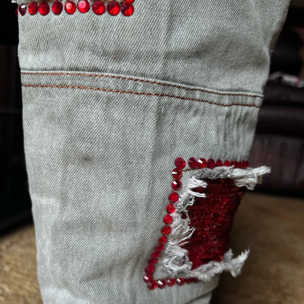 Woman’s multi-color red stone denim pointy toe knee-high boots.